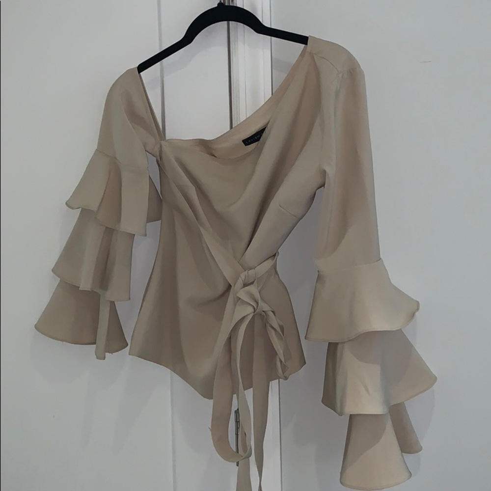 Off the shoulder, puff sleeve top with wrap.